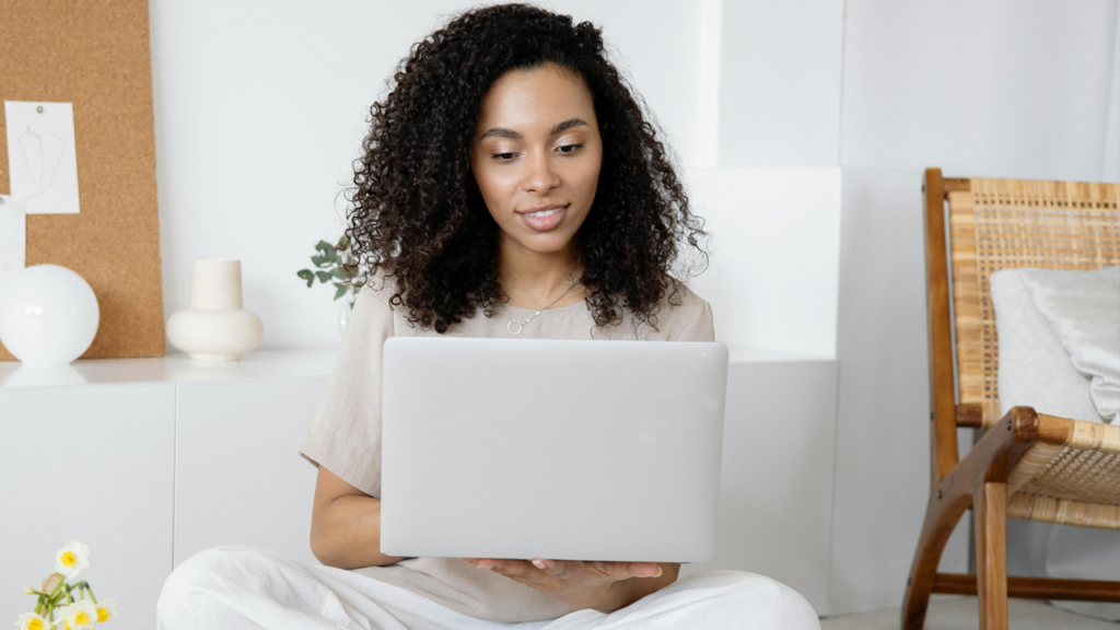 Girl writing on laptop