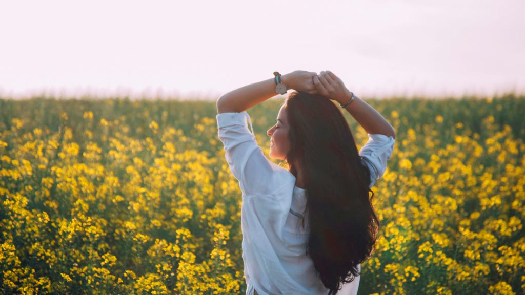 Woman reflecting in a meadow