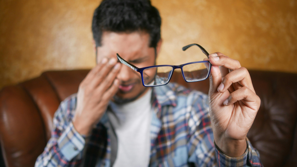 Man with strained eyes