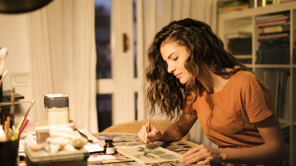 Girl painting at a table